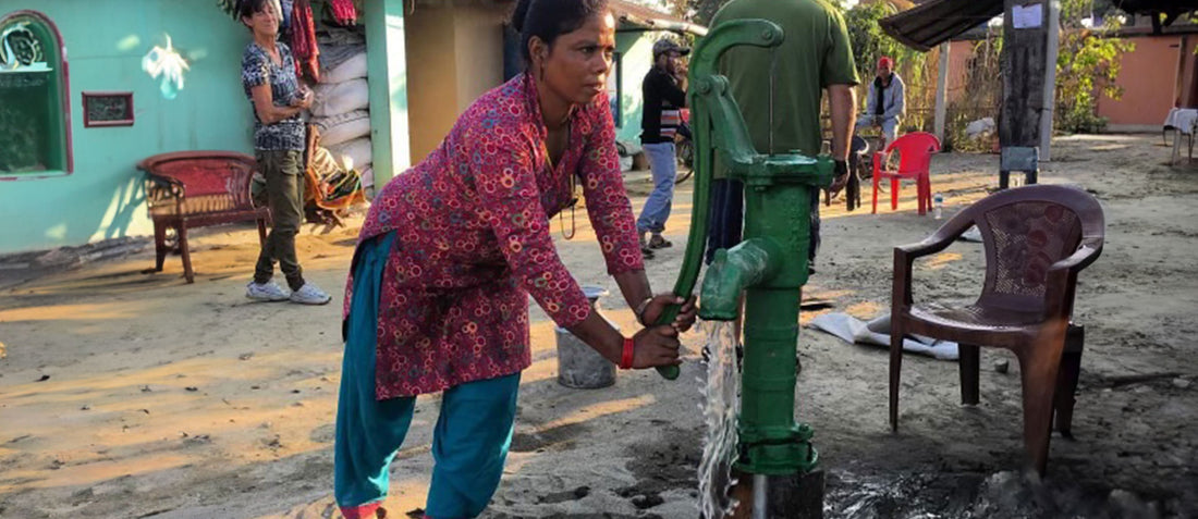 Woman pumping water